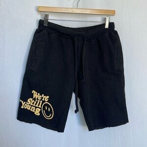 FanJoy “We’re Still Young” Cutoff Sweat Shorts Size S Black Yellow Happy Face
